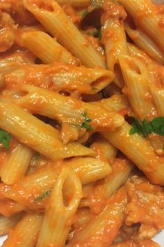 pasta with tomato sauce and parsley on top