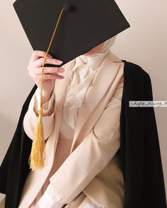 a woman wearing a graduation cap and gown