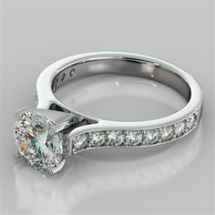 a princess cut diamond engagement ring with channel set diamonds