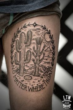 a man's thigh with a cactus tattoo on it