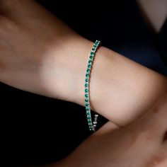 Product Details Elevate your gifting game with this stunning and beautiful Created Emerald Tennis Bracelet, adorned with Round Shape Lab Created Emerald gemstones elegantly set in a secure Prong Setting. This bracelet is not just a gift; its a unique and timeless expression of your appreciation. Shell proudly wear it on any occasion, cherishing both the bracelet and the sentiment behind it. Product Information SKU SHP-BRACELET072017906 Length 178 mm Width 3 mm Weight 8.45 gm (Approximate) LAB CR Emerald Tennis Bracelet, Lab Created Emerald, Yellow Gold Bracelet, Emerald Gemstone, Tennis Bracelet, Arm Band, Round Shape, Prong Setting, Lab Grown