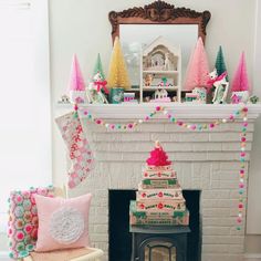 a christmas tree sitting in front of a fire place next to a fireplace with decorations on it