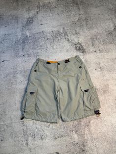 Please read and ask before buying this item. This is used clothing! Look all pics.  Make sure that suits you👌  ---------------------------- Vintage OAKLEY RARE Software Cargo Mens Parachute Shorts Size: XL(Seen Measurements) Condition 9/10 (Seen all photos.)  Ask more questions  OFFERS 👋  Follow me ✅  ----------------------------  ❗️Many buyers without reading the description later ask questions:  Why didn't I receive the item or where is it?  Delivery usually arrives 14/20/30/45 days after purchase. But there are delays due to what?  Due to holidays, weather conditions, customs checks, etc. Functional Streetwear Cargo Pants With Built-in Shorts, Vintage Cotton Cargo Shorts With Pockets, Functional Cargo Shorts With Built-in Shorts For Streetwear, Military Camouflage Cargo Shorts For Streetwear, Military Cargo Shorts For Outdoor, Vintage Shorts, Used Clothing, Suits You, Mens Shorts