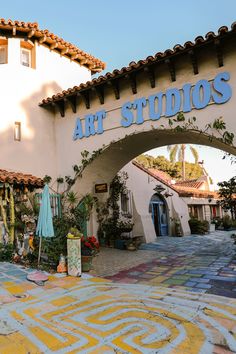 the entrance to an art studio is painted in bright colors