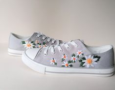 Ditsy Daisy shoes have been hand embroidered to give you that perfect wildflower spark to your outfit!  The embroidery is made with colourfast DMC/Anchor thread which means that you can keep on wearing these shoes without being worried about damage. These shoes are handmade to order so shipping can take up to two weeks but if there is a lull in orders you may get them quicker. If you need them after  put it in the order notes and we will see what we can do! Available in converse and non branded Cute Cotton Lace-up Sneakers, Cute Lace-up Cotton Sneakers, Cute Lace-up Canvas Shoes For Spring, Spring Embroidered Canvas Shoes With Round Toe, Summer Cotton Canvas Shoes With Vulcanized Sole, Cute Spring Canvas Shoes With Rubber Sole, Cute Canvas Shoes With Rubber Sole For Spring, Low-top Appliqued Sneakers For Spring, Spring Cotton Lace-up Sneakers