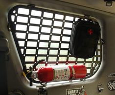 the inside of a fire extinguisher with its door open