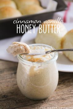 cinnamon vanilla honey butter in a glass jar with a spoon next to it on a wooden table