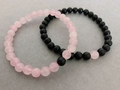 These His 'n' Hers matching bracelets feature rose quartz and black onyx beads. 🖤 - A powerful protection stone, Black Onyx absorbs and transforms negative energy, and helps to prevent the drain of personal energy. Black Onyx aids the development of emotional and physical strength and stamina, especially when support is needed during times of stress, confusion or grief. 💗 - Lowering stress and tension in the heart, Rose Quartz clears out anger, jealousy, and resentment of others, and allows he Couples Matching Bracelet, Couple Bracelets Beads, Matching Bracelets Ideas, Beaded Bracelets Matching, Couple Beaded Bracelets, Matching Bracelet Ideas, Couple Matching Bracelets, Matching Bracelets For Couples, Matching Jewelry For Couples