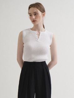 This is a minimal and modern top by VLETI that is made out of high quality and sturdy material. With distinctive mood of the design and comfortable wear, you can style it for your casual daily outfit.- Slim fitted sleeveless silhouette- Four buttons on the front- Minimal and feminine mood White Sweater Vest For Everyday Summer Wear, Chic White Vest For Everyday Wear, Chic White Vest For Everyday, Chic Sleeveless Sweater Vest For Everyday, Casual Sleeveless Knit Top For Everyday, Minimalist Sleeveless Tank Top For Everyday, Minimalist Sleeveless Top For Everyday, Versatile White Tank Top For Work, Chic Sleeveless Knit Top For Everyday