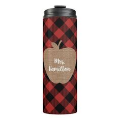 a red and black plaid pattern can cooler with an apple on it that says miss hamilton