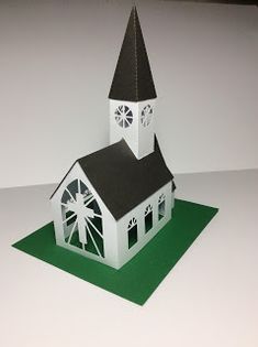 a paper model of a church with a clock tower