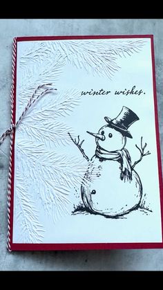 a handmade christmas card with a snowman on it and the words winter wishes