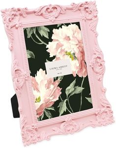 a pink frame with flowers on it and a label that says, lauren & arley