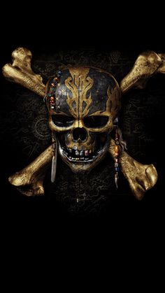 a pirate skull and crossbones with gold paint on it's face in the dark