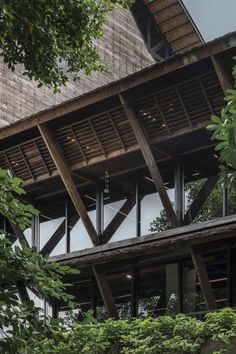 the side of a building that is surrounded by trees