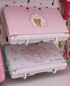 two children's laptops sitting on top of each other