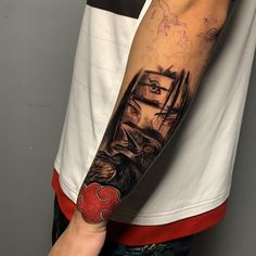 a man with a tattoo on his arm