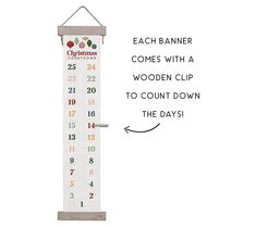 a white wall hanging with numbers on it and the words each banner comes with a wooden clip to count down the days