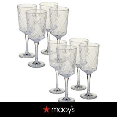 six clear wine glasses are lined up in a row on a white background with the words macy's written below them