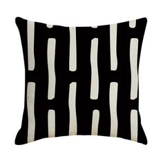 a black and white pillow with lines on it