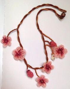 The one of a kind asymmetrical beaded cherry blossom necklace, 100% designed and hand-crafted by me! This 40 cm unique, artisan jewelry is meant to look exactly like the magnificent spring cherry blossom branches so you can wear one on your neck and look like an ethereal nymph! It is entirely made with premium quality miyuki glass beads that they are known to made exclusively in Japan and are considered one of the most refined, luxurious tiny beads in the world! You will not wear a simple necklace. This is a piece of art made with thought, care, love, and the highest quality materials. In the personalization section, you can type the length you prefer as well as your own adjustments regarding the style of the necklace. *Its piece is slightly different from the original one as this design i Handmade Adjustable Pink Necklace, Pink Bohemian Flower Pendant Necklace, Bohemian Pink Flower Pendant Necklace, Bohemian Pink Beaded Flower Necklace, Pink Beaded Necklaces With Bead Caps, Pink Beaded Necklaces With Round Beads And Bead Caps, Pink Necklaces With Bead Caps For Gifts, Handmade Whimsical Flower Necklaces, Delicate Handmade Pink Flower Necklace