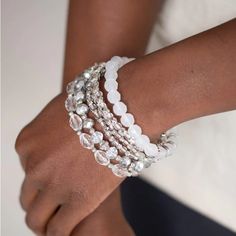 Infused With Silver Accents, A Glassy Collection Of White And Metallic Crystal-Like Beads Are Threaded Along Stretchy Bands Around The Wrist For A Whimsically Layered Look. Sold As One Set Of Six Bracelets. Bag 2 Bin B White Beaded Crystal Bracelet For Party, White Crystal Bracelet For Party, White Round Beads Crystal Bracelet For Party, White Crystal Beaded Bracelets For Party, White Crystal Bracelet With Round Beads For Party, White Crystal Bracelet With Faceted Beads For Party, Bracelets Bag, Silver Beaded Bracelet, Sparkle Bracelet