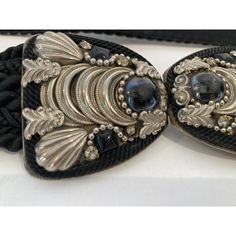 Judith Leiber Black Belt with Silver and Black Stones bubble Buckle. black cotton silk velvet waist belt. Categories : Women Category: Accessories Sub-category: Belts Material: Cotton Color: Black Buckle is 2" H x 4 " wide. Total Length 25 inches. Known for her amazing purses, Judith Leiber’s creativity continued with accessories such as this beautiful estate adjustable belt from the 1980s with semi-precious stone-studded. Hungarian born Judith Leiber (1921-2018) was known as the handbag designe Designer Party Belts, Elegant Black Belt For Evening, Designer Adjustable Black Belt, Chic Black Belt For Evening, Vintage Black Adjustable Belt, Luxury Black Embroidered Belt, Adjustable Black Evening Belt, Vintage Adjustable Belt For Party, Adjustable Vintage Party Belt