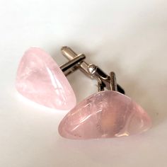 Rose Quartz Cufflinks. Men's cuff links, pink tumbled polished stones. These natural gemstones are light pink, some with milky and clear passages. Each is securely attached to silver electroplated cufflinks. Please read on for important info * Stones average ~1.5cm at their widest * Silver electroplate over copper cufflinks. * Secure, easy-to-use, bullet-back hardware. * Each is securely attached with aircraft grade bonding * Handmade using natural stones. * Please allow for slight variations in Formal Pink Rose Quartz Jewelry, Adjustable Polished Finish Cufflinks For Gift, Mens Cuff Links, Gift For The Groom, Wedding Cuff Links, Wedding Cuff, Wedding Cufflinks, Best Man Gift, Mens Cuff