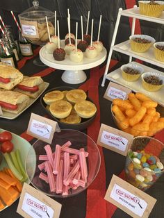 a table topped with lots of food and desserts