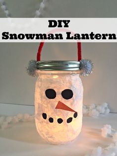 a mason jar filled with snowman lanterns