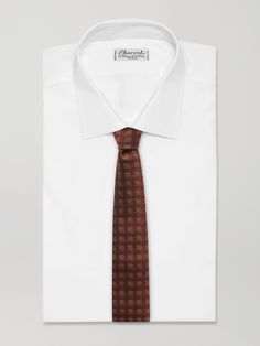 Brunello Cucinelli's tie is jacquard-woven in an artful geometric motif that looks hammered and lustrous. It's been made in Solomeo, Italy from premium silk and has an 8cm blade. Classic Patterned Silk Suit And Tie Accessories, Classic Patterned Suit And Tie Accessories For Formal Occasions, Classic Patterned Suit And Tie Accessories, Classic Patterned Suit And Tie Accessories For Business, Classic Formal Patterned Ties, Classic Patterned Neckwear For Business, Elegant Formal Patterned Neckwear, Elegant Patterned Neckwear For Formal Occasions, Luxury Patterned Ties For Business