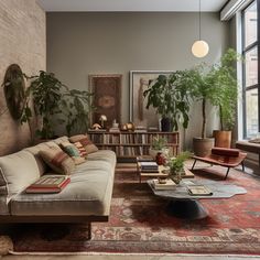 a living room filled with lots of furniture and plants on top of a red rug