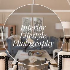 a living room filled with furniture and a large round mirror over the top of it