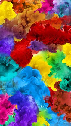 multicolored ink is being mixed in with each other to create an abstract pattern