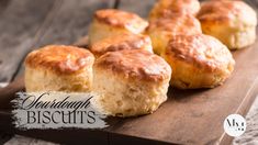 some biscuits are sitting on a wooden board