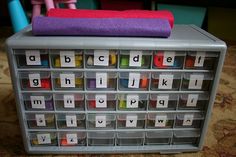 a plastic container filled with lots of different types of letters and numbers on top of each other