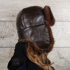 Real brown mink fur aviator hat, brown leather, Charles model, for women. Unisex. This hat will go perfectly with those wanting to combine beauty and practicality. Mink fur adds a touch of classic and sophistication to this accessory. This chapka can be worn in three ways using the drawstrings:1. Attached under the chin for colder days.2. Tied up, for warmer days.3. Tied towards the back, your ears and neck are covered while having the earflaps raised. Very practical! So, ideal depending on the temperature or the desired style. Warmer than the competition, this model has earflaps long enough to protect the cheeks and neck against the cold and wind. In addition, the interior is lined with a very soft, non-irritating black woolen fabric, which will keep you warmer than a usual quilted lining Fur Hat Men, Sewing Tape Measure, Aviator Hat, Mens Fur, Starting From The Bottom, Fur Hat, Handmade Hat, Mink Fur, Smell Good