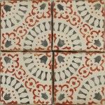 four tiles with red and white designs on them