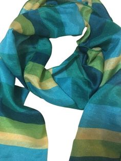 An effortless way to add a pop of color to any outfit! This versatile scarf is just the right weight to keep you comfortable while making a bold, fashion-forward statement. Crafted with a lightweight, high-quality blend of green, teal, and yellow, it's sure to turn heads. Designed with convenience in mind, this scarf is lightweight and easy to fold, making it ideal for travel or a night out. Plus, it's soft on the skin and won't irritate even the most sensitive skin. So no matter the season or o Trendy Green Silk Scarf For Spring, Striped Scarf, Striped Scarves, Form Fitting Dress, Lightweight Scarf, Yellow Stripes, Bold Fashion, Pet Hair, Sensitive Skin