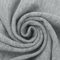 a close up shot of the fabric on a grey shirting material, which is very soft