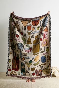 a table cloth with food and drinks on it