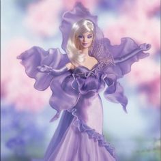 a barbie doll in a purple dress standing on a flowery field with her arms outstretched