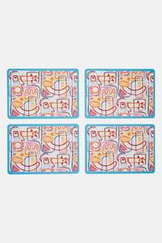 four placemats with colorful designs on them