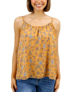 Yellow Floral Cami Beautiful and flowy, the new Mustard Floral Ruffled Swing Cami brings an easy elegance to your cool weather style! This flowy cami top features a warm yellow floral print with soft pops of blue and cream that are sure to brighten up any fall day. The swingy silhouette and dainty ruffle along the neckline make this cami top a comfortable, flattering, new favorite go-to for the season! Why you’ll love it: Flowy spaghetti strap mustard floral cami top with feminine, swingy silhou Yellow Floral Print Tank Top For Spring, Yellow Flowy Casual Blouse, Flowy Yellow Casual Blouse, Mustard Tank Top For Spring, Chic Yellow Spaghetti Strap Top, Casual Flowy Spaghetti Strap Top, Casual Flowy Yellow Blouse, Casual Rayon Camisole, Spring Rayon Top With Spaghetti Straps