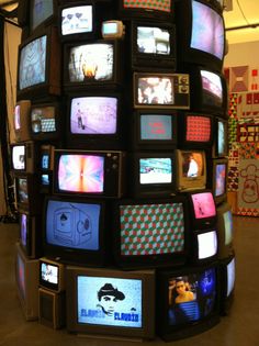 there are many televisions stacked on top of each other