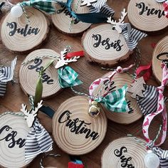 wooden ornaments with names and ribbons on them