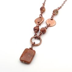 "This necklace measures 21.75\" long (55.5cm) and features a red fossilized coral bead.  I have paired it with antiqued copper tone chain.  I've accented it with birdseye rhyolite beads. The toggle clasp and spacer beads are made from copper-plated leadfree pewter.  The textured ring, headpin, chain, and links are made of copper plated base metal.   The jump rings are made of enameled copper. The fossil coral bead measures 13/16\" long (20mm).  The birdseye rhyolite beads measure 5/16\" in diame Fossilized Coral, Enameled Copper, Fossil Coral, Textured Ring, Coral Necklace, Head Pins, Coral Beads, Copper Plated, Toggle Clasp