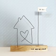 a wooden sign that says you are my home and a house with a heart on it