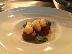 a white plate topped with food on top of a table