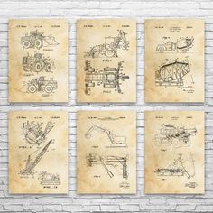 four tractor blueprints on a brick wall